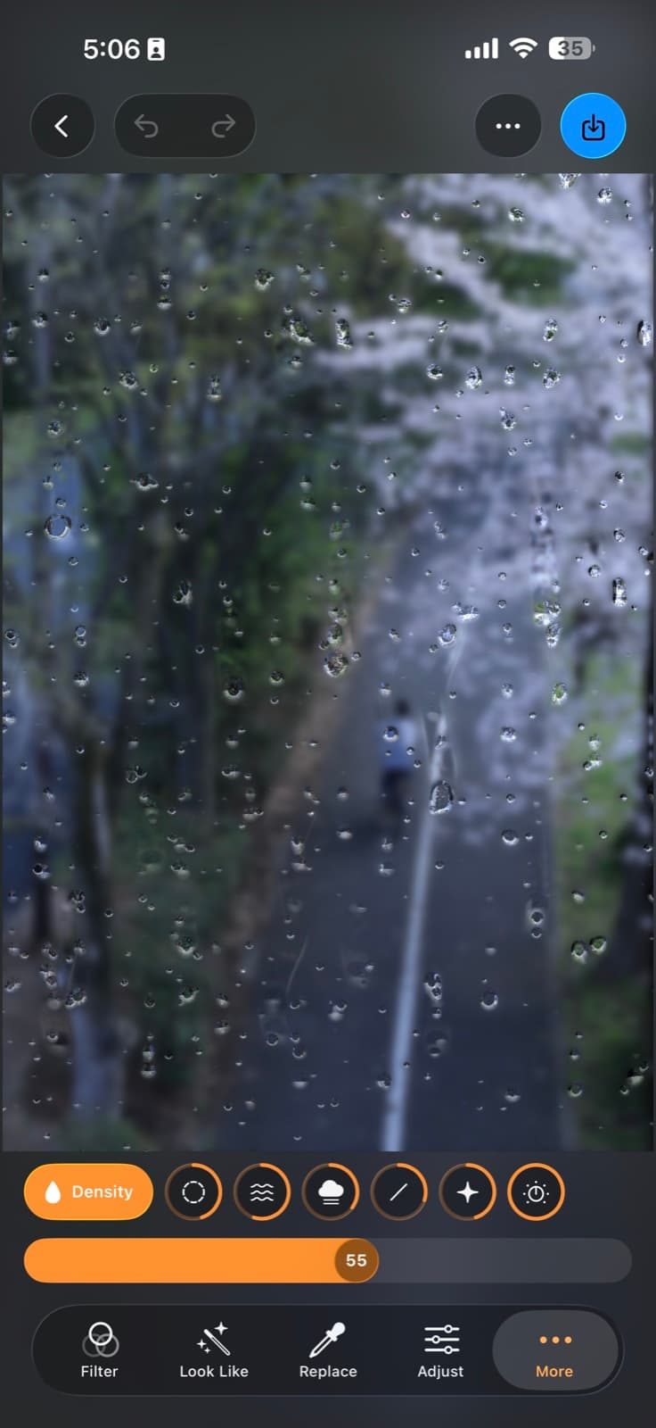 Filmera's rain-on-glass effect over a spring street scene